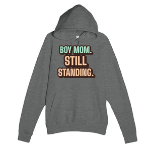 Boy Mom. Still Standing — cute graphite heather unisex hoodie